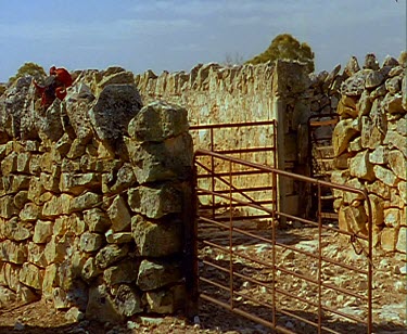 Stone walls and fence sheep pen