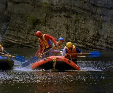 River canyon rafting  - having a water fight.