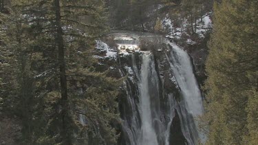 Powerful waterfall in winter