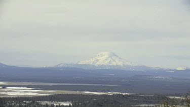 Majestic Mt. Shasta in winter and from afar