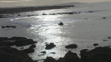 Gentle waves on pristine cove and shoreline