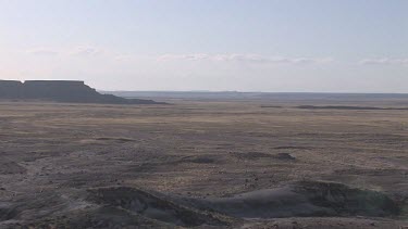 Big grassy desert prairie plains with distant mesas