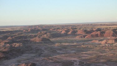 Big desert valley with mounds, hills and mesas