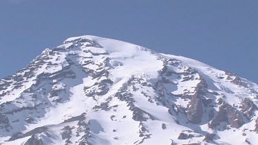 Mountain with snowy peak and blue sky