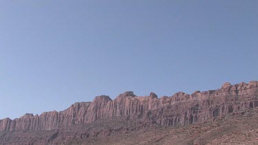 Rocky Canyon Wall; sheer and deep; monumental buttes, boulders, and mesas