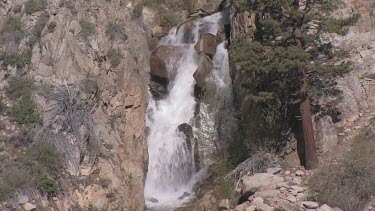 Cascading, mountainside waterfall in spring