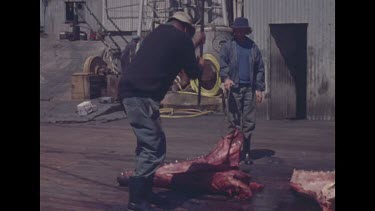 factory men chopping meat