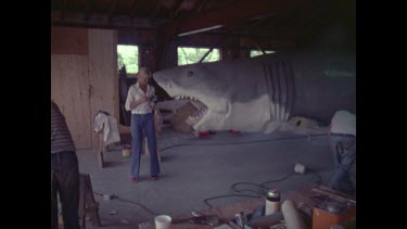 men working on jaws shark