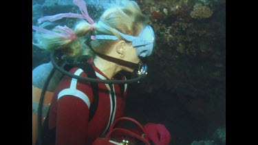 Moray Eel is fed by Valerie pulling fish out of handbag
