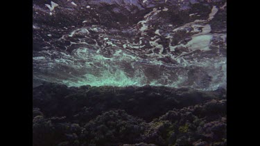 waves from underwater reef shallows