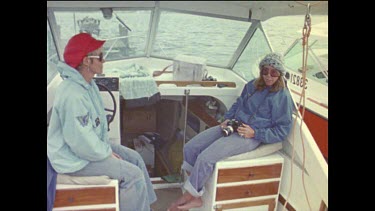 Valerie Taylor as activist, on board speed boat with photographer, photographing Albany whaling station.