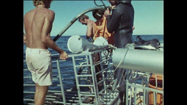 Two shots. Damage caused to shark cage while filming Jaws.