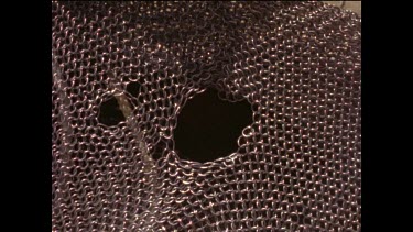 Sequence. Damage caused to chain mail mesh suit during great white shark attack. Testing Great White Sharks bite and attack method.