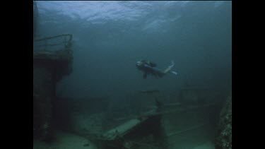 diver explores wreck of a Japanese fishing boat