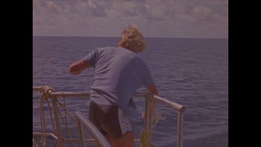 fisherman Mark Heighes pulls mackerel onto deck
