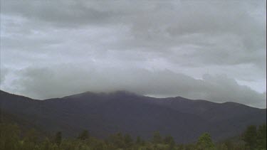 Timelapse of Boiling Clouds Over Mountains