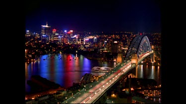 Sydney city at night. Harbour Bridge with city in background.