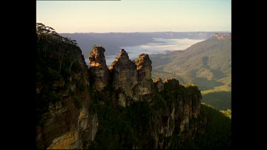 Blue Mountains. Three sisters mountain peaks with cloud covered valley in background