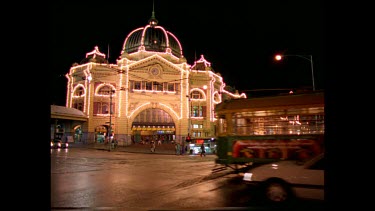 Flinders Street Station, night. Exterior. Decorated with Christmas lights.