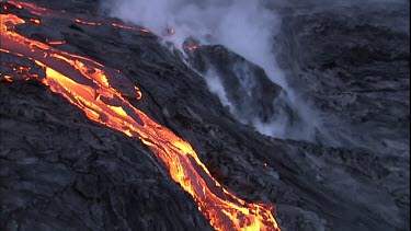 Steam and lava flow. Recently solidified lava crust