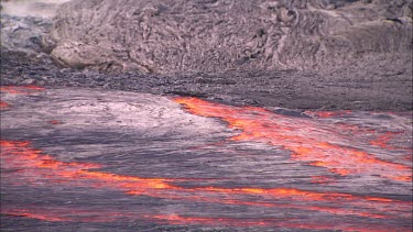 Lava flowing in channel. River of lava