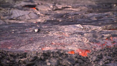 Lava flowing in channel and heat haze