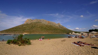 Woman Sunbathing At Stavros Beach & Lagoon, Stavros, Crete, Greece, Europe
