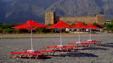 Red Sun Beds, Parasols, Castle & Mountains, Frangokastello, Crete, Greece
