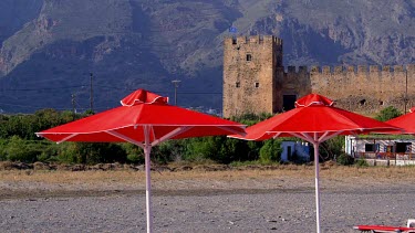 Red Parasols, Castle & Mountains, Frangokastello, Crete, Greece