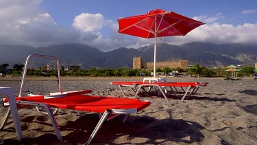 Red Sun Beds, Parasols, Beach, Castle & Mountains, Frangokastello, Crete, Greece