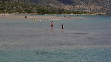 People Walking In Elafonisi Lagoon, Elafonisi, Crete, Greece