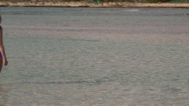 Teenage Girl Walks In Sea, Elafonisi, Crete, Greece
