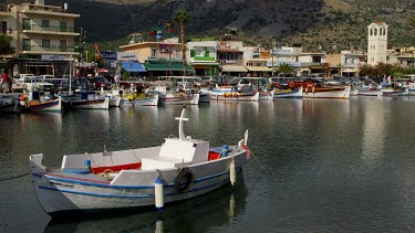Fishing Boats & Clock Tower With Reflections, Elounda, Crete, Greece