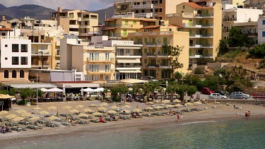 Buildings & Eastern Bay Beach, Agios Nikolaos, Crete, Greece