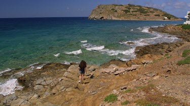 Teenage Girl On Rocks With Dog, Mochlos, Crete, Greece
