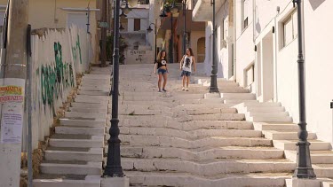 Mother & Daughter Walk Down White Steps, Sitia, Crete, Greece