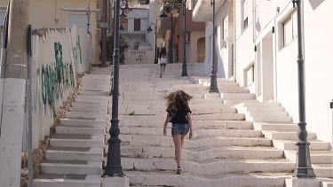Mother & Daughter Walking Up White Steps, Sitia, Crete, Greece
