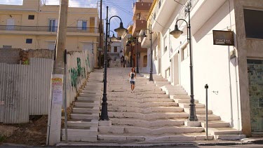 Woman Walking Down White Steps, Sitia, Crete, Greece
