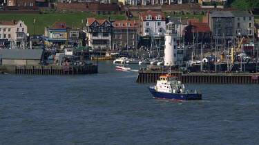 Lifeboat Approaches Harbour, Scarborough, North Yorkshire, England