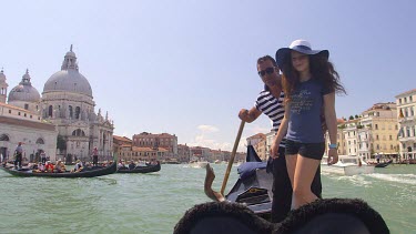 Teenage Girl Poses For Photograph With Gondolier, Venice, Italy