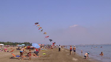 Kite Seller & Tourists On Beach, Lido, Venice, Italy