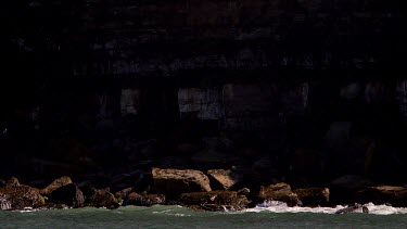 Waves, Rough Sea & Dark Cliffs, North Sea, Scarborough, North Yorkshire, England, United Kingdom