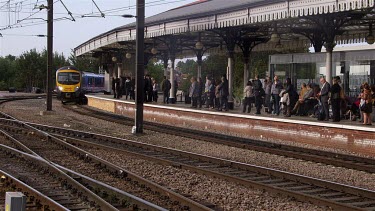 Passengers Wait At Platform For First Transpennine Express Class 185 128 Train, York Railway Station, North Yorkshire, England