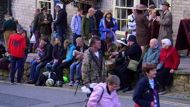 Group Of People Sat On Wall, Pickering, North Yorkshire, England