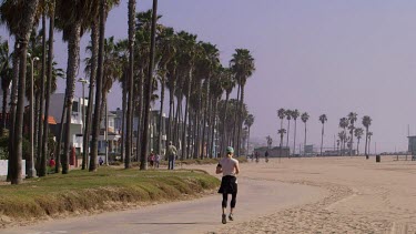 Lady Jogging On Venice Boardwalk, Venice Beach, Venice, California, Usa