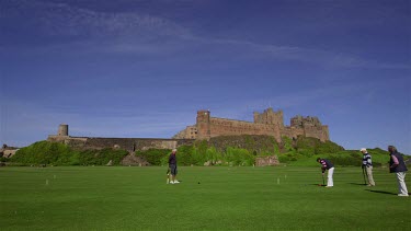 Croquet Being Played Infront Of Bamburgh Castle, Northumberland, England
