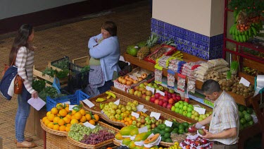 Customer At Fruit & Vegetable Stall, Funchal Market, Madeira, Portugal