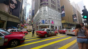 Pedestrians Crossing Queens Road At D'Aguilar Street, Central, Hong Kong, Asia