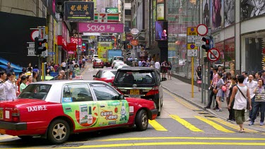 Pedestrians Crossing Queens Road At D'Aguilar Street, Central, Hong Kong, Asia