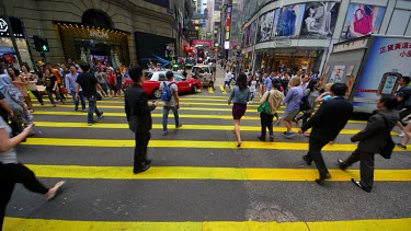 Pedestrians Crossing Queens Road At D'Aguilar Street, Central, Hong Kong, Asia